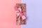 pink fruit chocolate with raisins and nuts on lilac and pink color background Dessert Time concept Flat lay Top view Candy shop