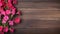 Pink geranium flowers on wooden background with copy space. Top view