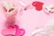 Pink girl party baby theme with ponies and hearts on felt background. Copy space