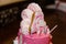 Pink girlish birthday cake with number four candle