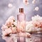 pink glass perfume bottle on a gray background, surrounded with flowers