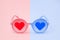 Pink glasses with red heart and blue glasses with blue heart