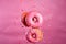 Pink glazed donuts in motion. High resolution.