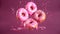 Pink glazed donuts in motion. High resolution.