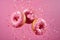 Pink glazed donuts in motion. High resolution.