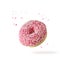 Pink glazed single donut with white sprinkles and crumbs flying on white