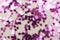 Pink glitter background unfocused. Abstract heart shaped purple sparkling glitter. Christmas, holidays