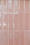 Pink glossy upright rectangular ceramic tile, background, texture