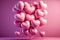 pink glowy heart-shaped balloons