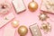 Pink and gold christmas gifts isolated on pastel pink background. Christmas mock up.