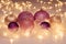 Pink and gold Christmas ornaments in fluffy downs