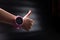 Pink gpswatch on hand. Children`s smart watch on black. Watch for kids