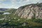 Pink granite mountain and alpine meadows in sunny day.