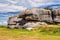 The pink granite rocks with strange shapes, coast in Brittany. The mass of enormous pink rocks, the pink granite, rock with