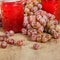 Pink grapes with jars of jelly on table