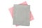 Pink and gray textile napkins on white