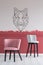 Pink and grey velvet bar stools in empty interior with burgundy and white ombre wall