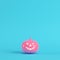 Pink halloween pumpkin, jack o lantern on bright blue background