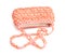 Pink handbag made of plastic beads over white