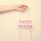 Pink Happy Easter text sign on a rope