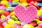 Pink heart and colorful smarties