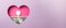 Pink heart shape on a purple background. In the heart are a white key from an old car and a fifty-dollar bill