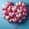 Pink Heart-Shaped Balloons Floating Against a Soft Blue Background