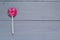 Pink heart shaped lollipop gray boards