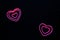 Pink hearts on black background for valentine`s day advertising baner