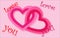 Pink hearts, which are associated with Valentine`s Day,