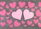 Pink hearts on wooden grey shabby chic background.