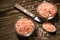 Pink Himalayan rock coarse salt in glass bowls on brown wooden table