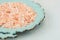 Pink Himalayan Salt on Vintage Turquoise Plate White Stone Tabletop Wellness Spa Healthy Diet Nutrition Ayurveda