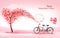 A Pink  Holiday Valentine`s Day background. Bicycle with a red ballons and tree with heart-shaped leaves