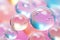 Pink holographic bubbles floating on the soft colorful abstract background in beautiful vivid tones.