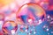 Pink holographic bubbles floating on the soft colorful abstract background in beautiful vivid tones.