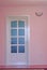 Pink home interior with door