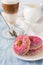 Pink homemade donuts with Latte Macchiatto