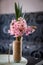 Pink hyacinth flower in homemade vase