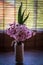 Pink hyacinth flower in homemade vase