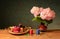 Pink hydrangea in a ceramic vase and yarns