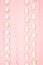 Pink kawaii background with borders of sweet meringue and marshmallows