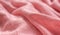 Pink knitted synthetic fabric texture background.
