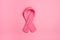 Pink Knitted Womens Breast Cancer Ribbon Symbol on background with extra room or space for copy, cropping, words, text or your des