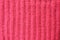 pink knitted wool background. elastic band binding texture one front one wrong