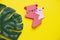 Pink koala made using the origami technique on a yellow background. DIY bookmark