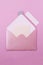 Pink letter envelope on a light purple background.