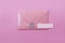 Pink letter envelope on a light purple background.