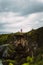 Pink lighthouse on a cliff overlooking the vast ocean in Saipan