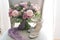 Pink and lilac wedding bouquet stands on a chair